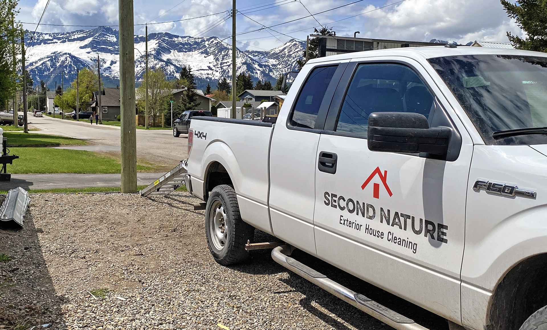 The Second Nature pickup truck with the logo on the side of it 