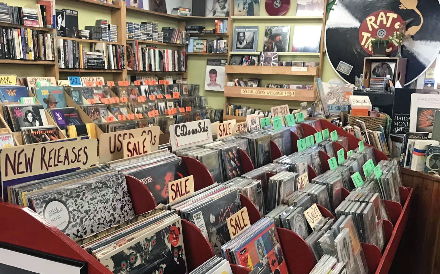 The interior of Packrat Annie’s, showing shelves of books and vinyl records on display 