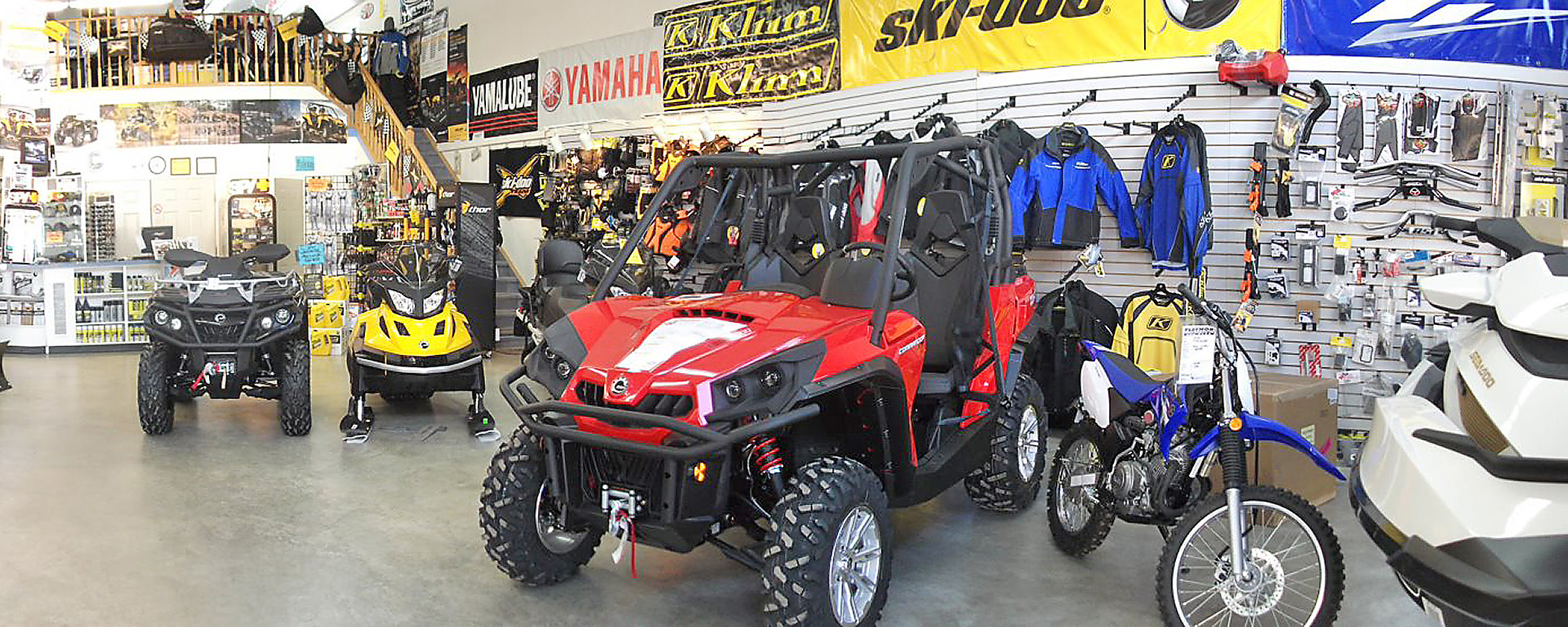 ATVs and side-by-side machines lined up in a showroom at Playmor Power Products 