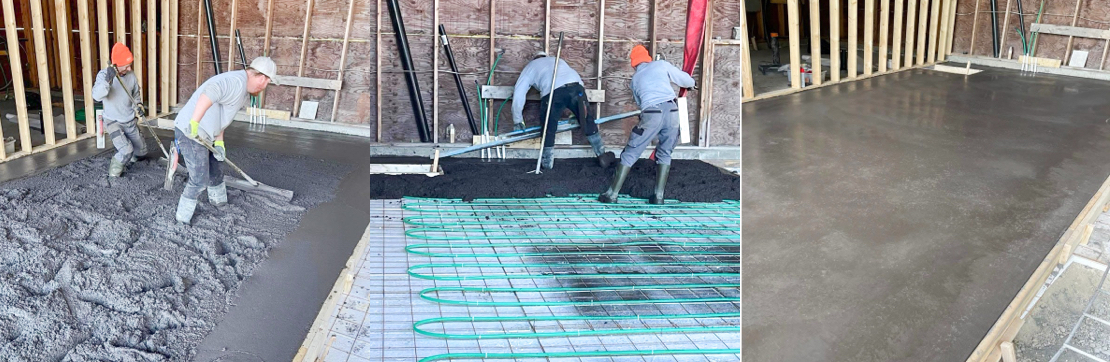 People in hard hats working on a construction site, spreading concrete