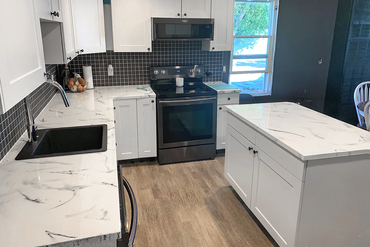 Kitchen countertops redone by Re-Coat Renovations 