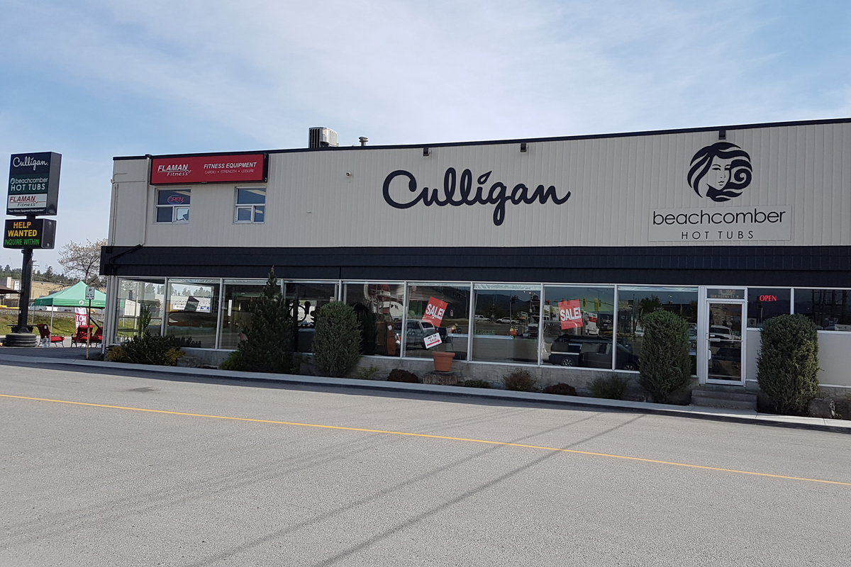 Exterior of building displaying signs saying Culligan and Beachcomber Hot Tubs 
