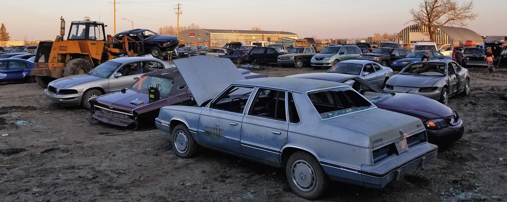 Lethbridge Auto Parts salvage yard in the evening. 