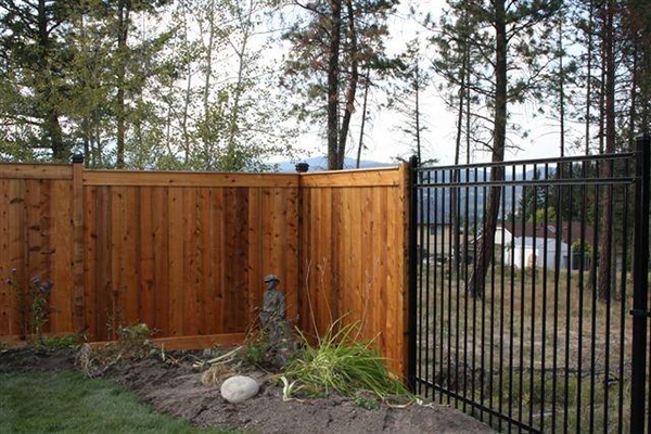 Vertical wooden fencing around property