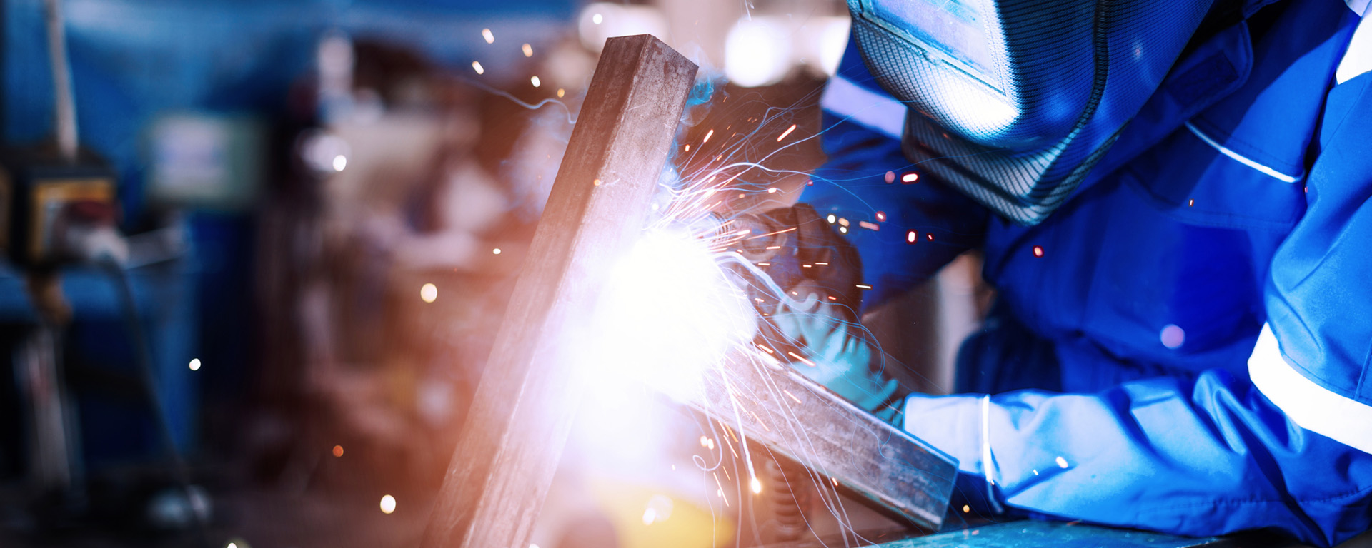 Welder working on custom part. 