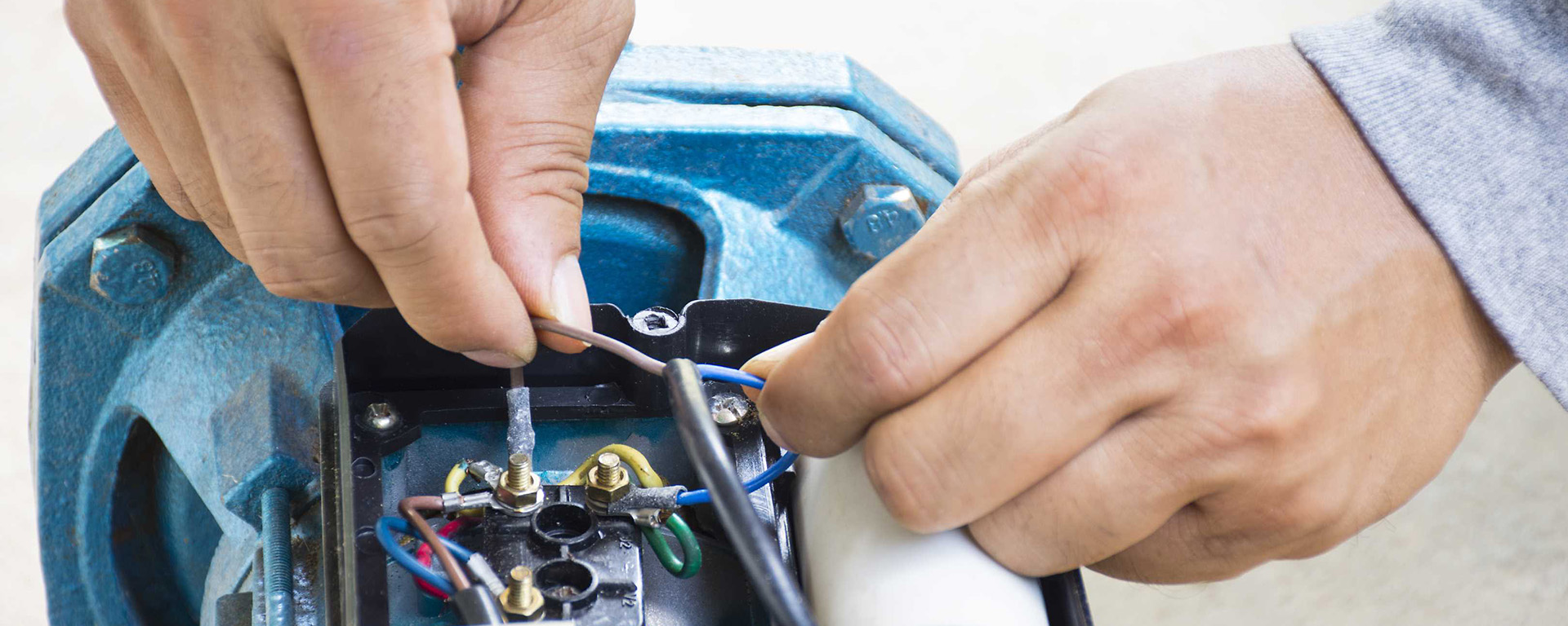 Close-up of someone repairing a pump 