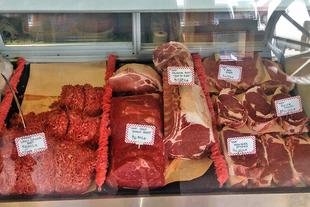 Raw meat in packages on display at Rick's Fine Meats and Sausage