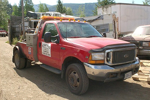red truck advertising Scrap King Auto Wrecking and Towing