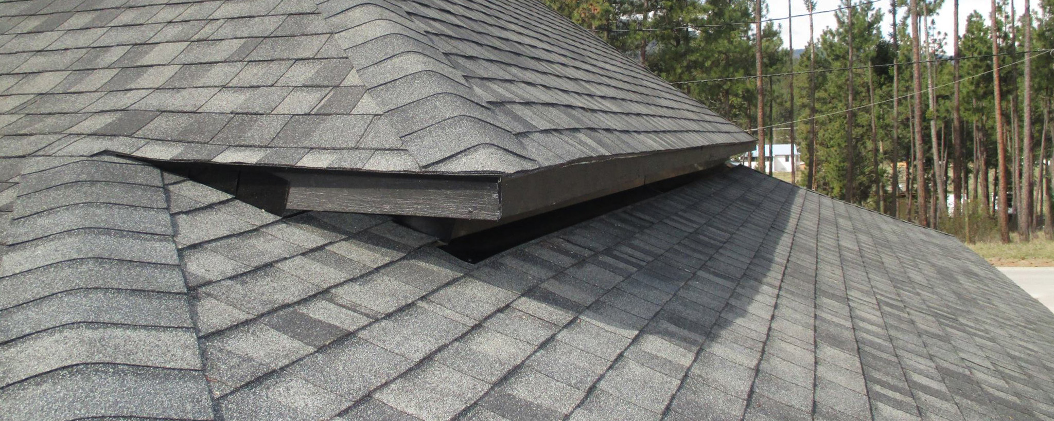 Close-up shot of a grey shingle roof in Cranbrook 