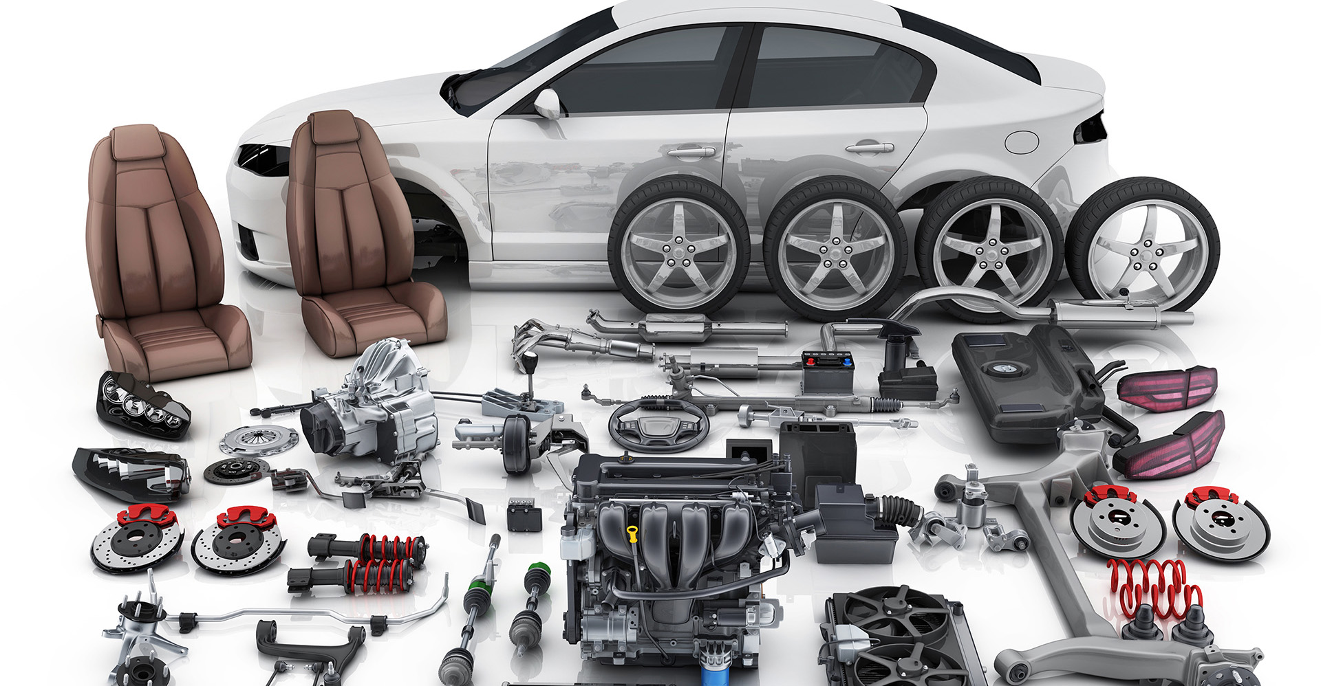 Assortment of car parts in foreground, with white four-door car in background. 