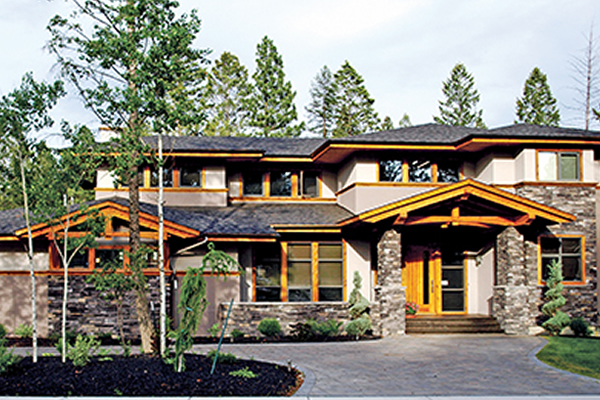 Showhome with cedar trim and rock work on front of home