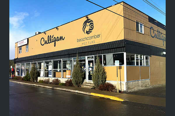 Exterior of building displaying signs saying Culligan and Beachcomber Hot Tubs