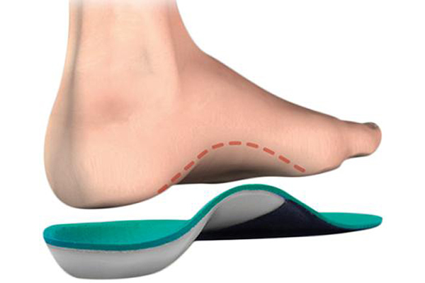 Bare foot stepping onto green foot pad