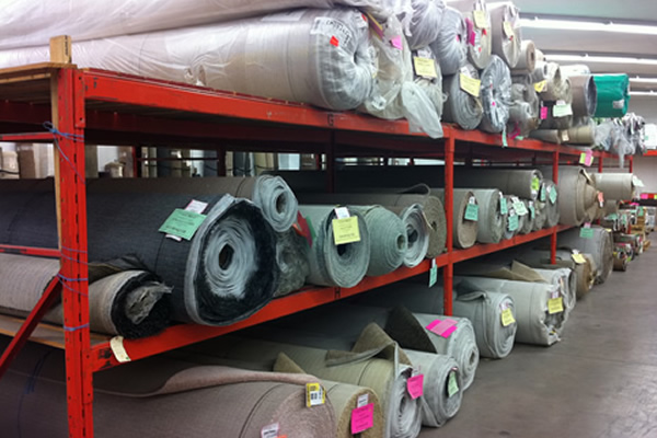 Rolls of carpet stored in inventory at Cranbrook Flooring