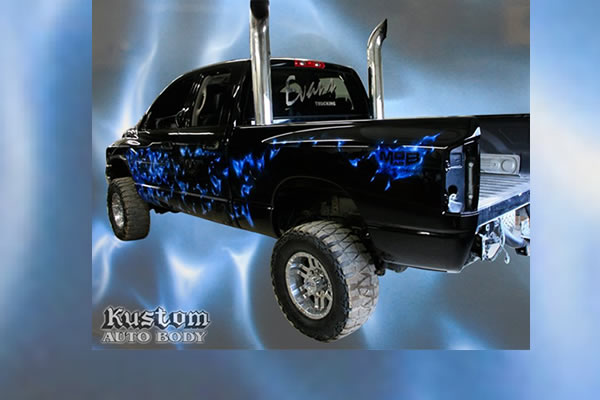 lifted black truck with bright blue customized paint design