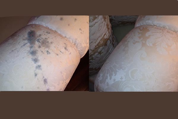 Before and after picture of wine spilled on the arm of a chair