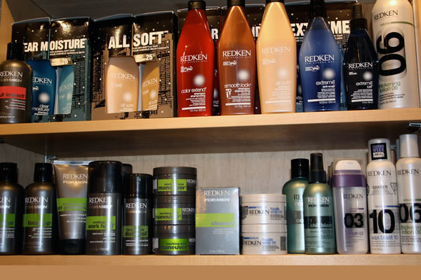 Hair product on shelves displayed at Waves On The Lake Hair Design