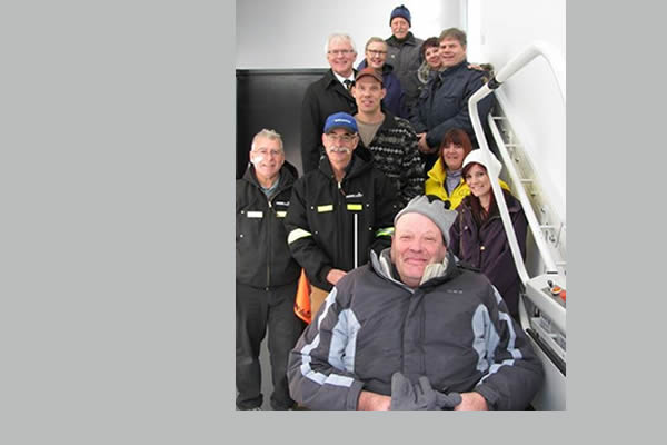 Group of staff members that work for Kootenay Columbia Home Medical Equipment posing in a stairwell