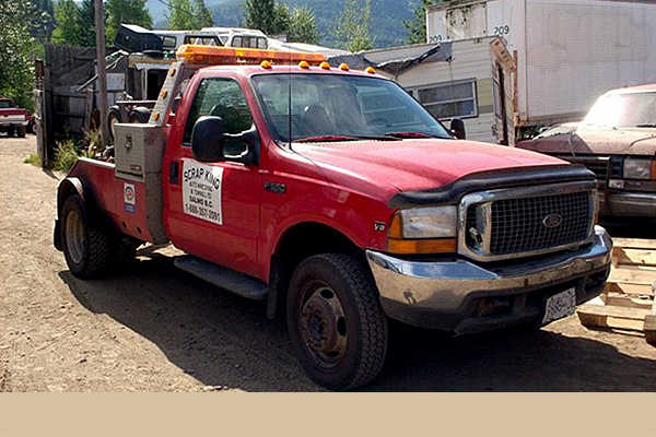 red truck advertising Scrap King Auto Wrecking and Towing
