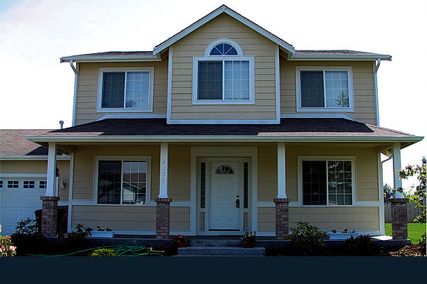 Exterior of a yellow sided showhome