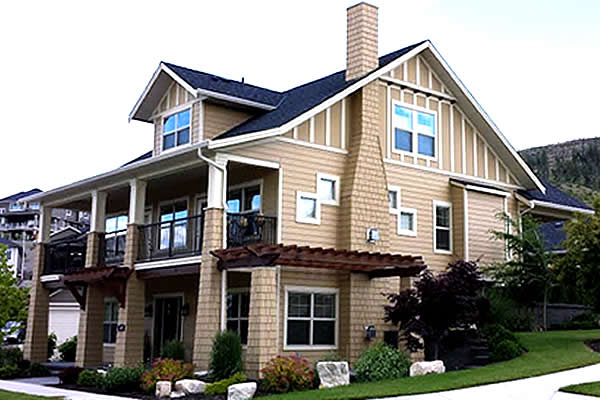 Side shot of the exterior of a show home will completed landscape
