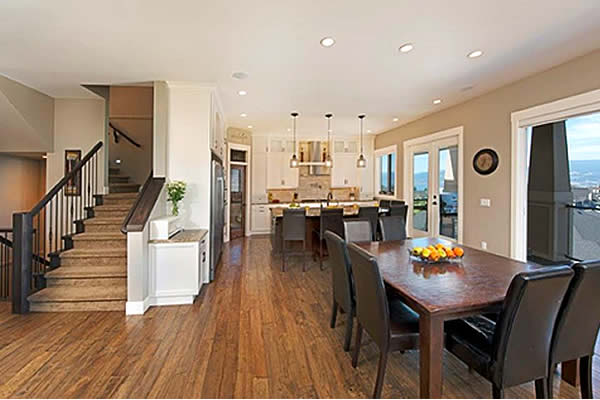 interior of a show home displaying a staircase and open dining area