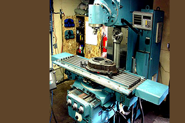 turquoise coloured drilling machine for metal