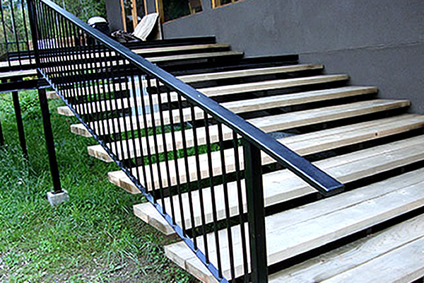 outside residential staircase with black metal railing