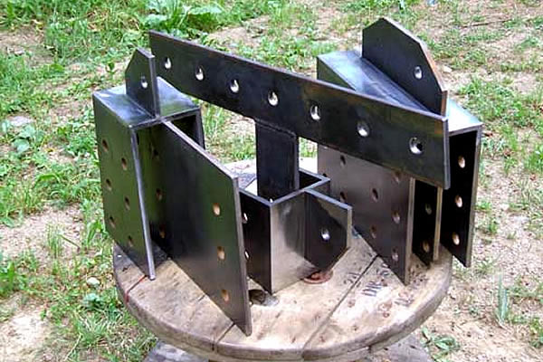 metal pieces with holes drilled on the sides
