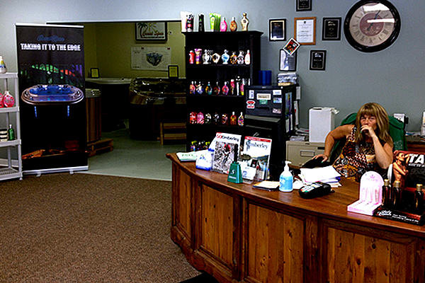 Lady sitting at the front desk at Marysville Hot Tubs.