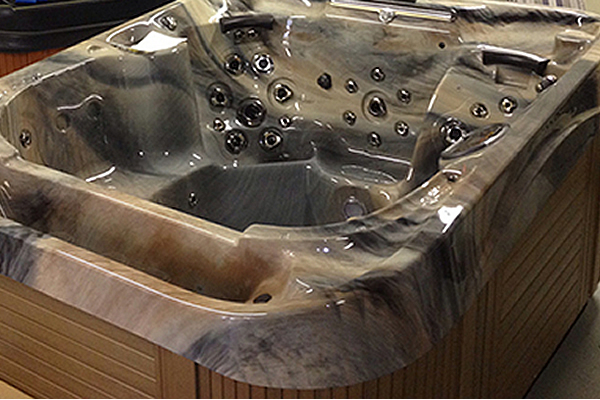 Three hot tubs on display