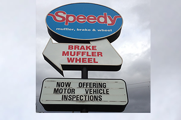exterior signs advertising Speedy Muffler, Brake and Wheel