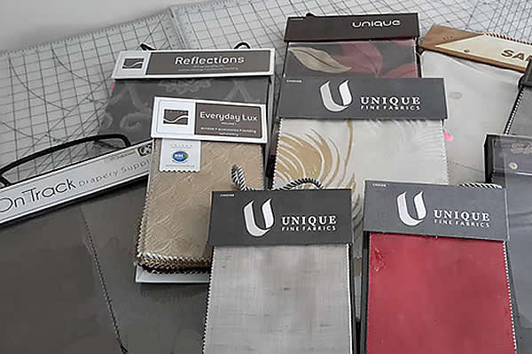 Samples of draperies in red, gray and brown tones