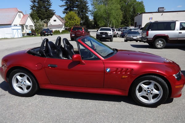 red sports car with its top down