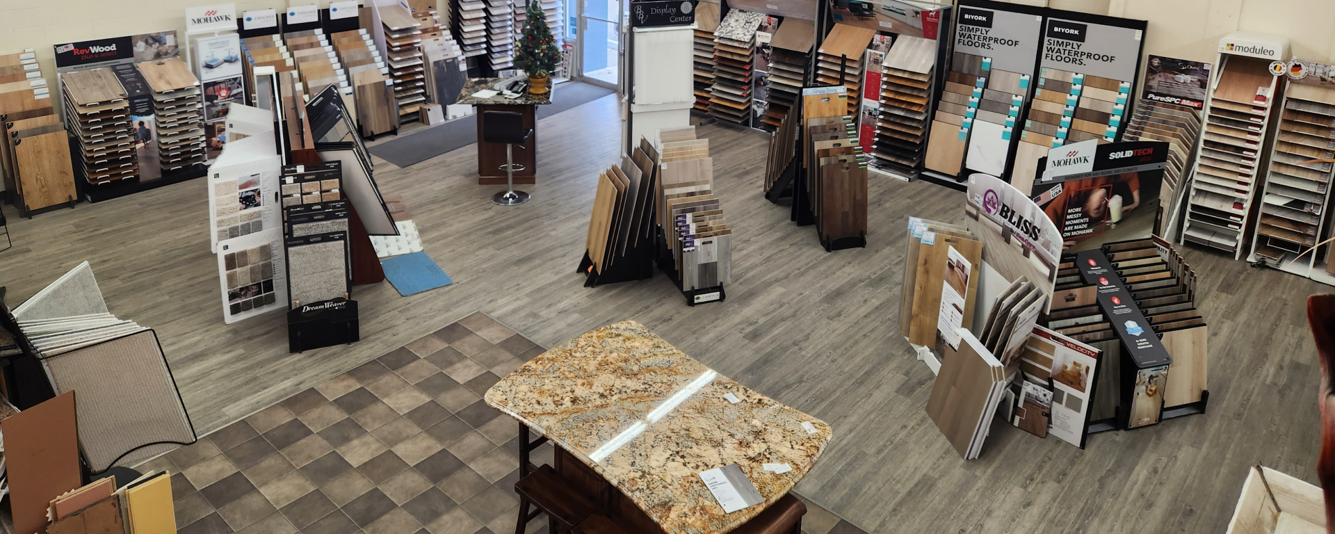 An overview of the Kerber Floors showroom, with carpeting and flooring samples 