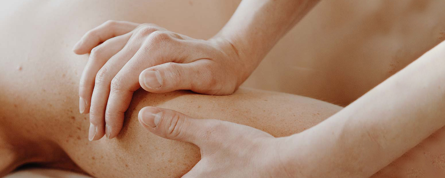 Hands massaging an arm 