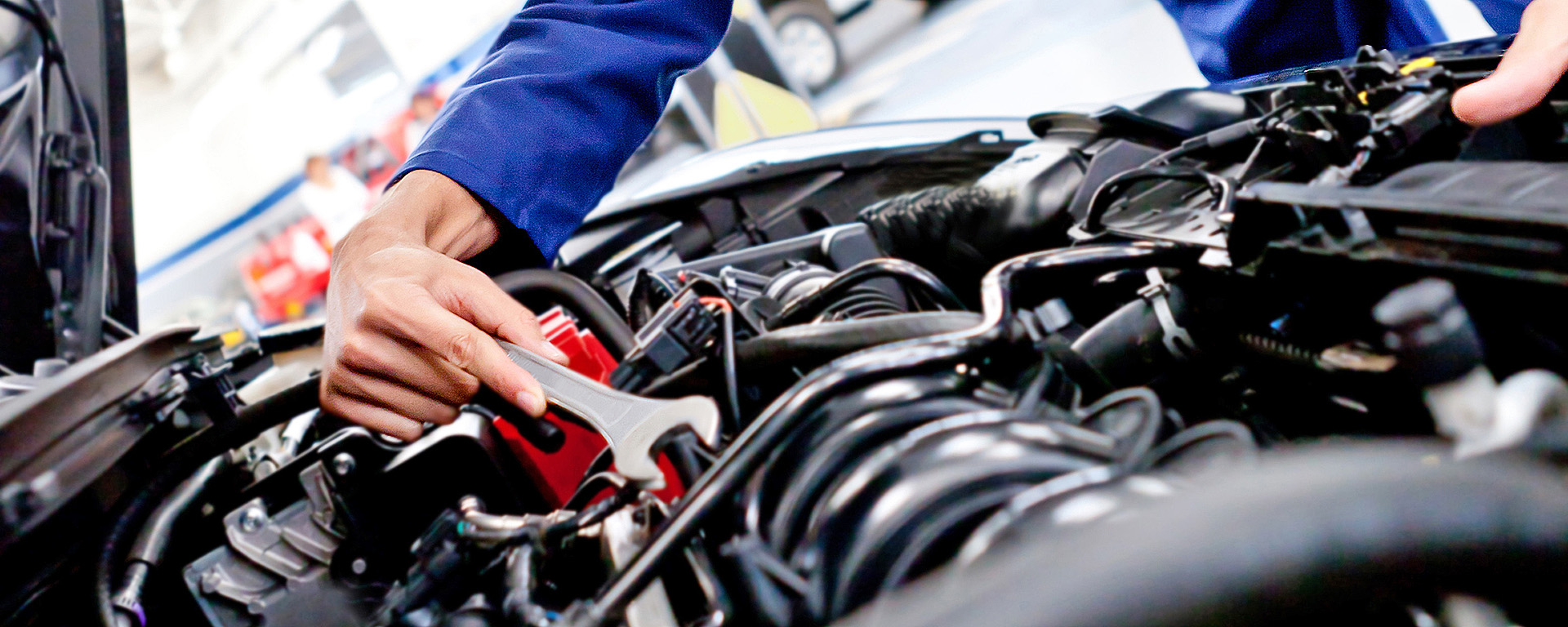 A mechanic working on an engine 