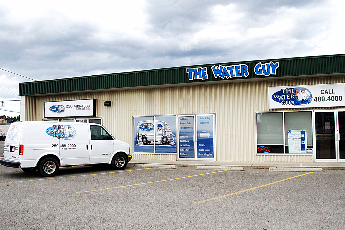 white company van advertising The Water Guy 