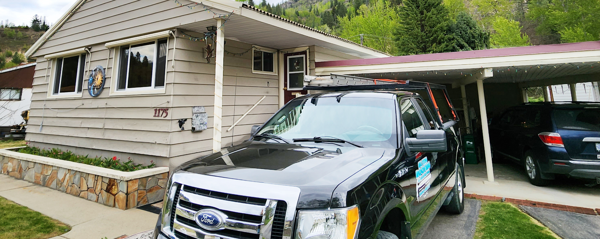 All Type Roofing and Renovating black Ford F-150 service truck parked in a residential driveway. 