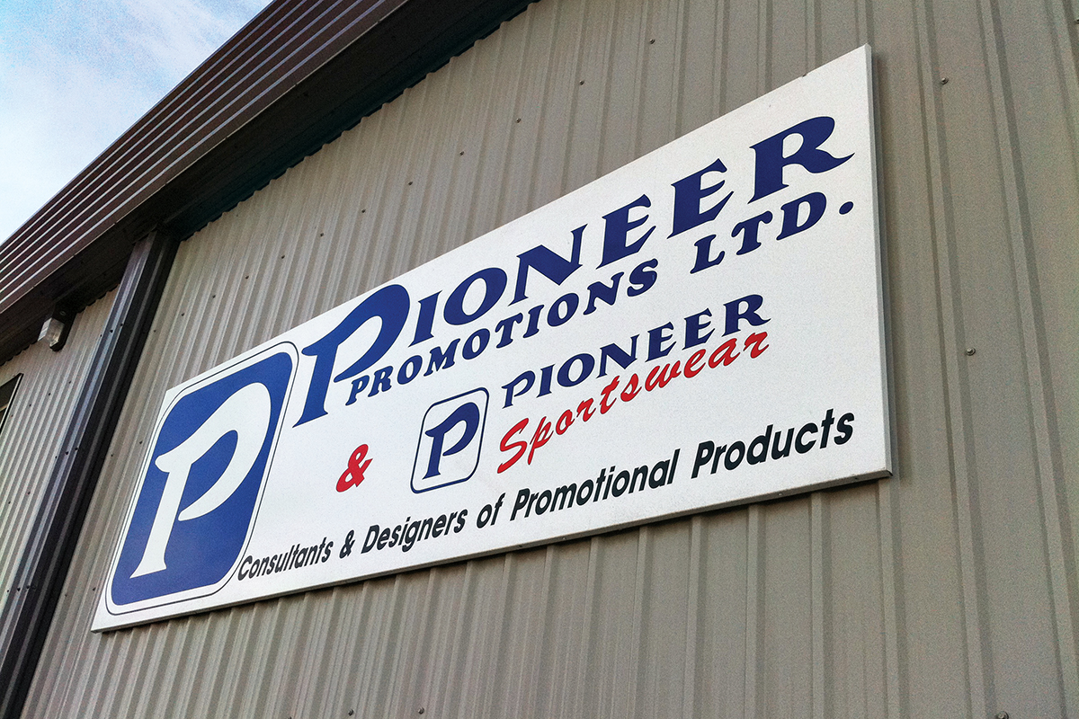 Exterior of building advertising company sign Pioneer Promotions limited and pioneer sportswear 